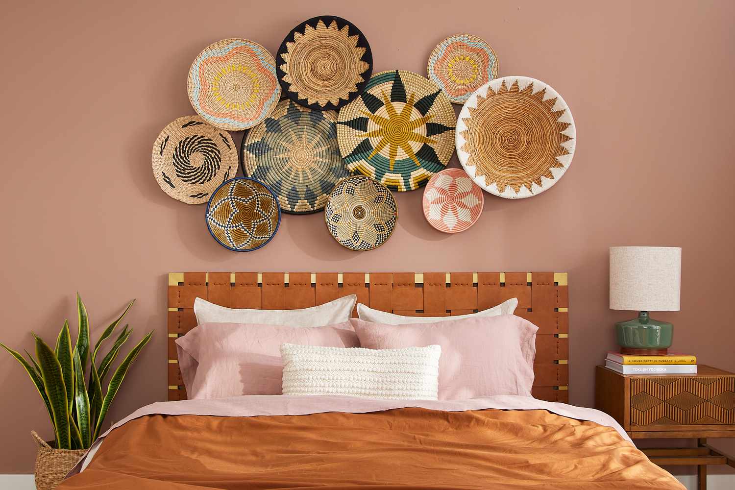 Woven basket decor hanging above bed in bedroom